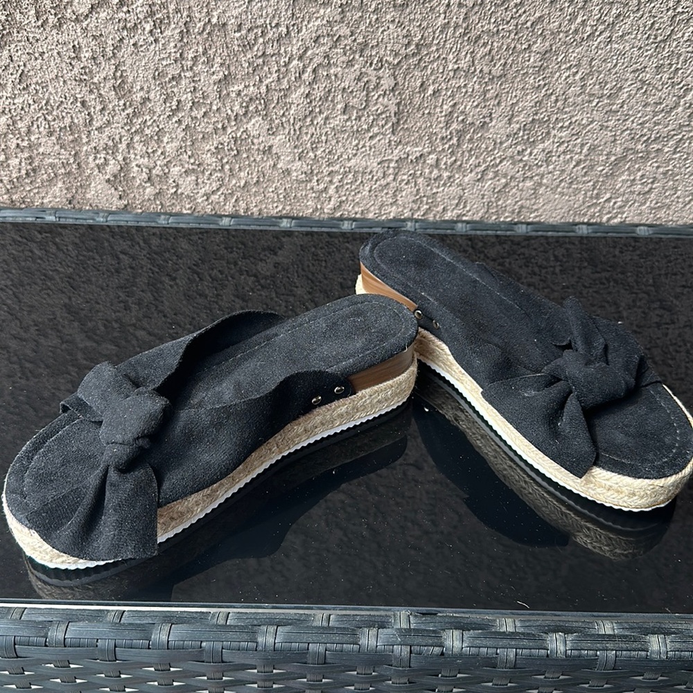 Never worn Woman’s sandals size 9 black velvet with wicker looking bottom.